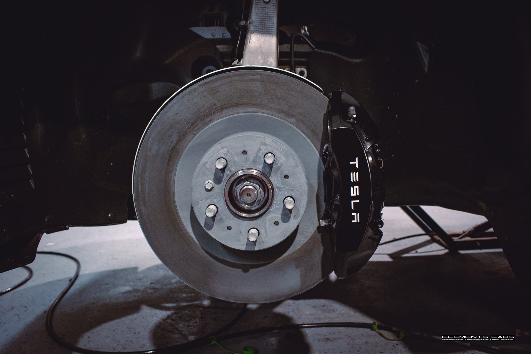 Tesla Model Y caliper paint detail after service