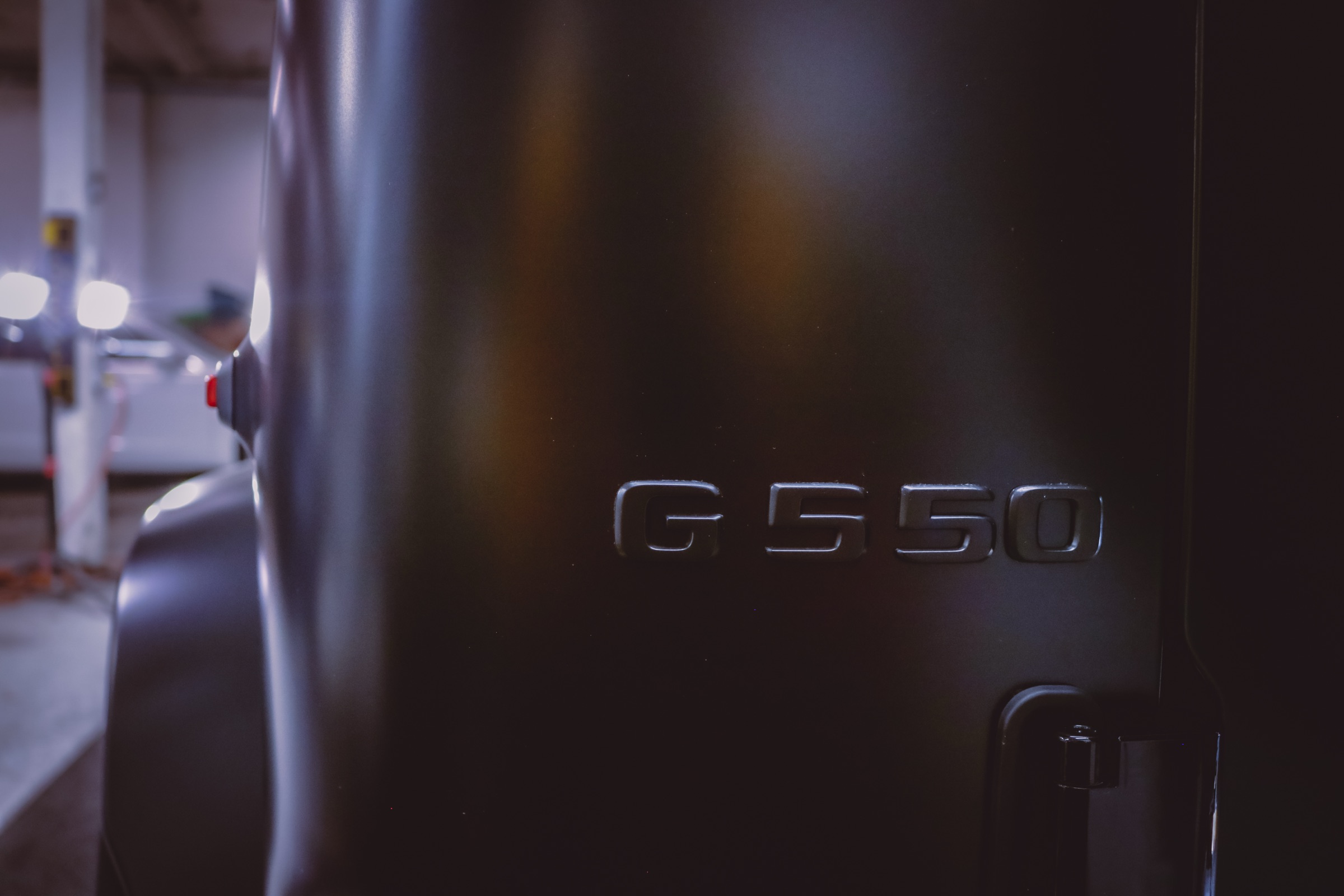 G 550 badge detail on a satin PPF protected Mercedes-Benz G-Class