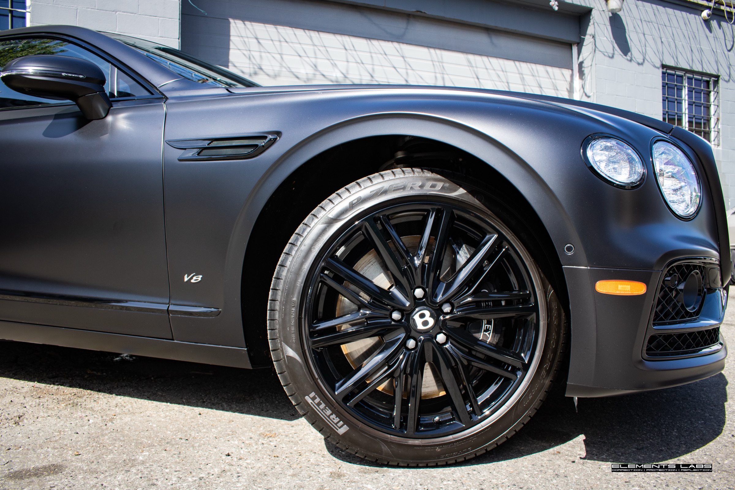 Wheel and fender detail on a 2024 Bentley Flying Spur matte/satin PPF finish