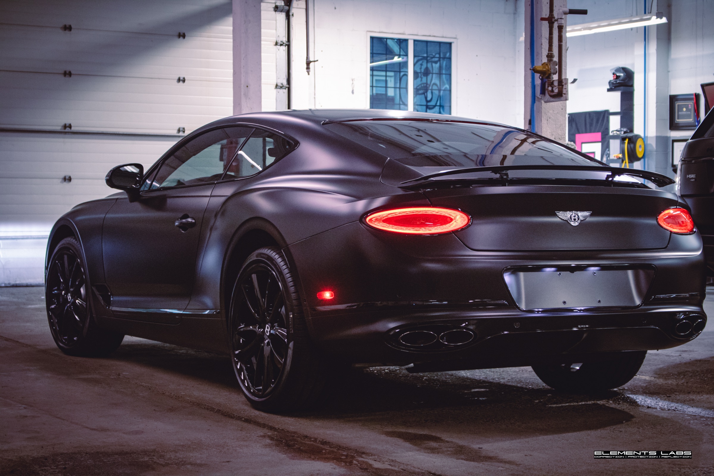 Rear three-quarter view of a Bentley Continental GT matte/satin PPF finish