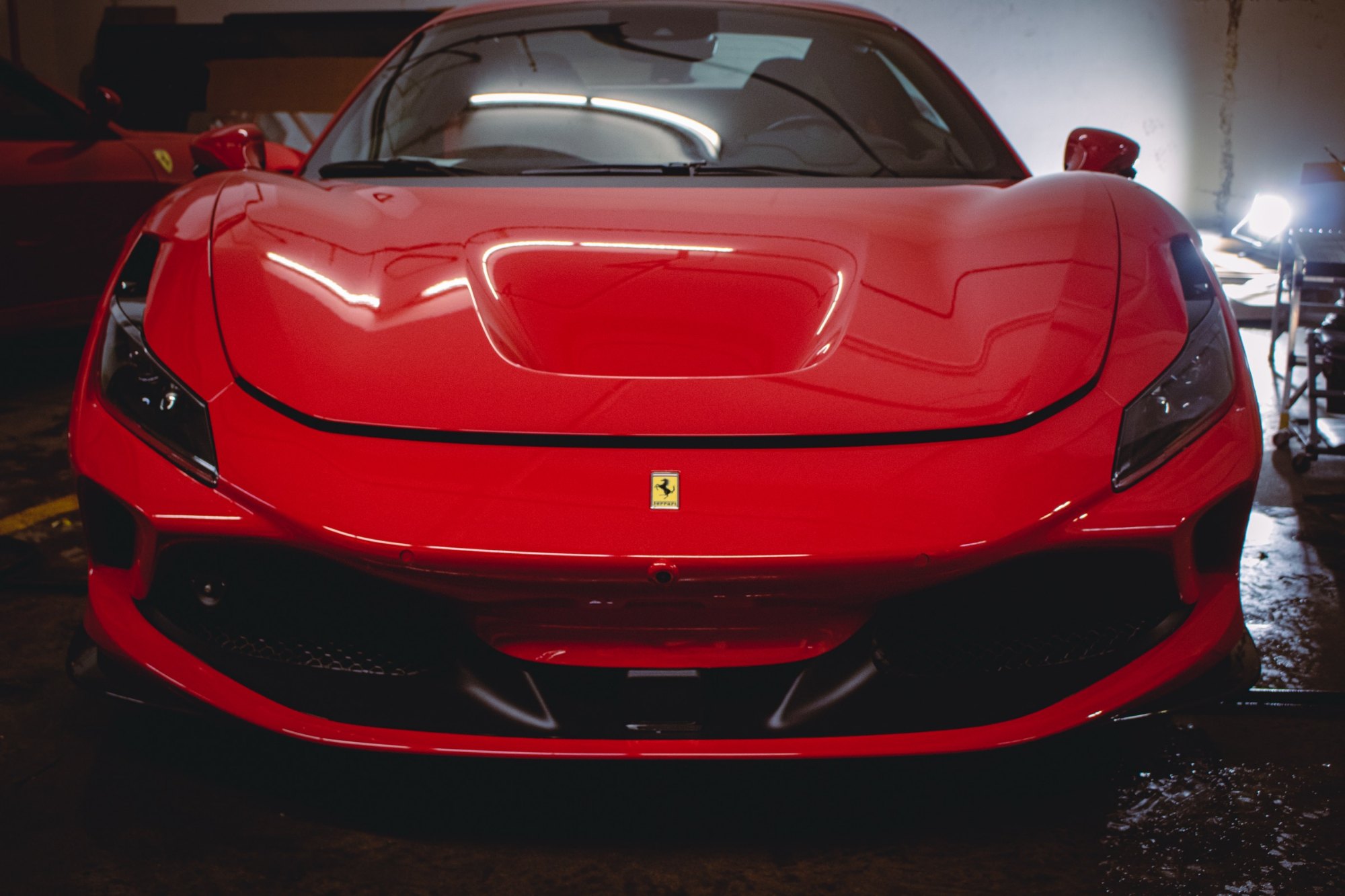 Front view of a 2023 Ferrari F8 Tributo Berlinetta after full gloss PPF and Ceramic Pro Ultimate ION