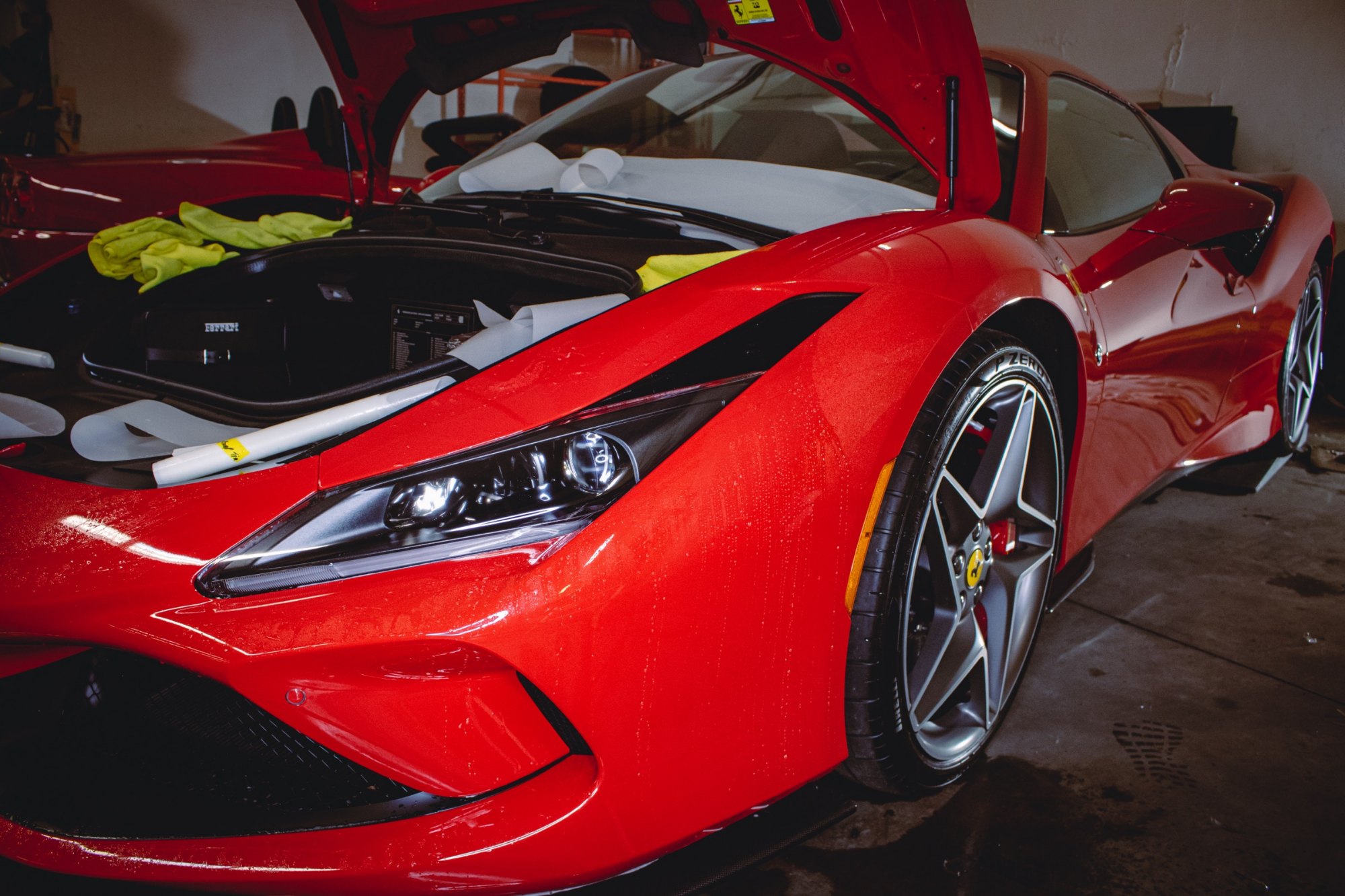 2023 Ferrari F8 Tributo Berlinetta during full gloss PPF and Ceramic Pro Ultimate ION prep