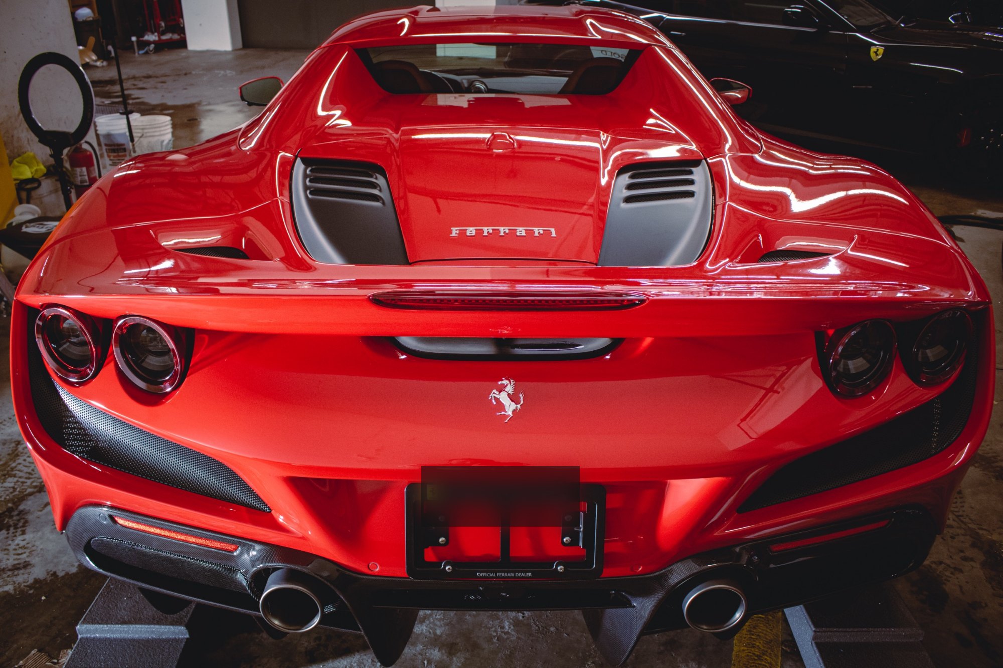 Rear bumper view of a 2023 Ferrari F8 Tributo Berlinetta full gloss PPF and Ceramic Pro Ultimate ION project at Elements Labs