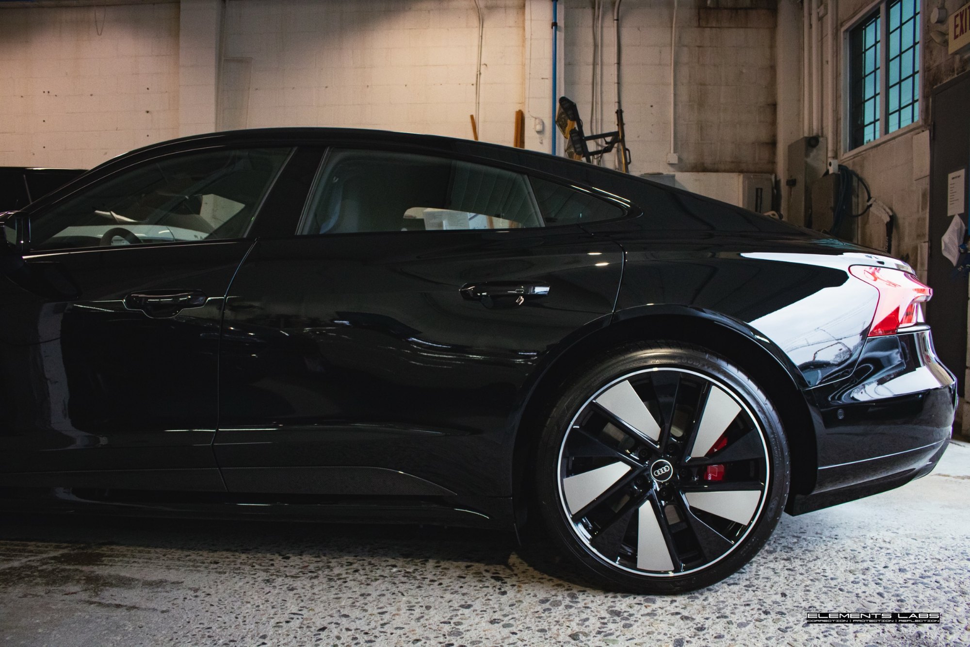 Side profile of a 2025 Audi e-tron GT after Ceramic Pro Ultimate ION protection work