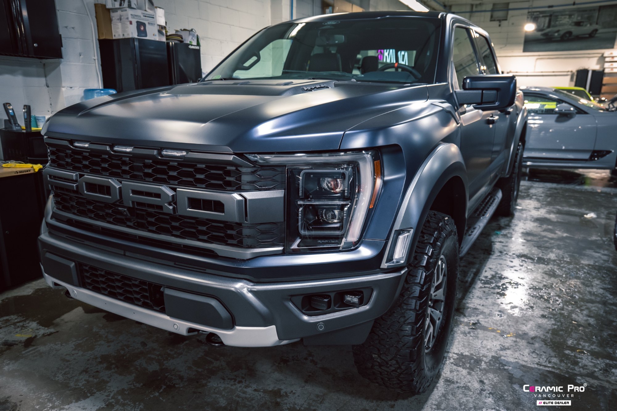 Front three-quarter view of a 2025 Ford F-150 Raptor after full gloss PPF and ceramic coating at Elements Labs