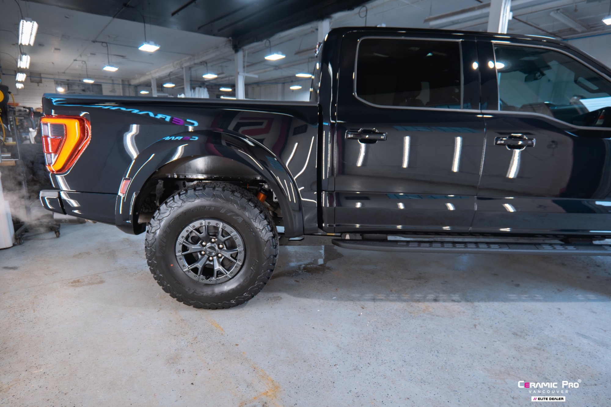 Side and rear view of a 2025 Ford F-150 Raptor after full gloss PPF and Ceramic Pro ION at Elements Labs