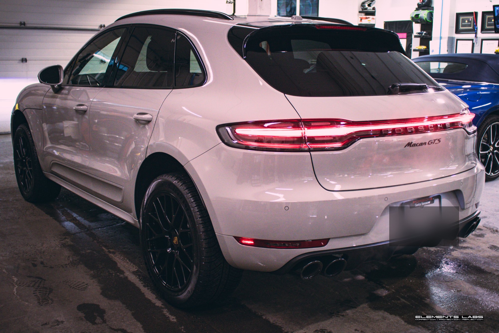 Rear three-quarter view of a 2024 Porsche Macan GTS after front-end PPF and Ceramic Coating Bronze