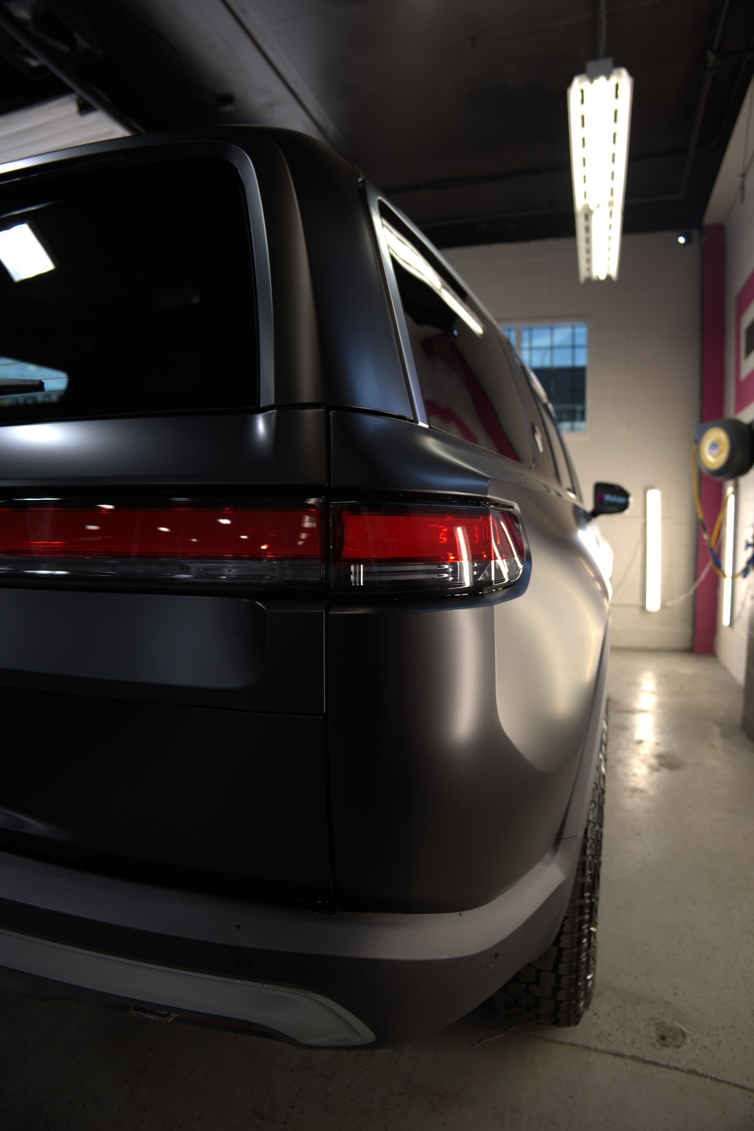 Rear detail of a 2024 Rivian SUV with satin PPF finish