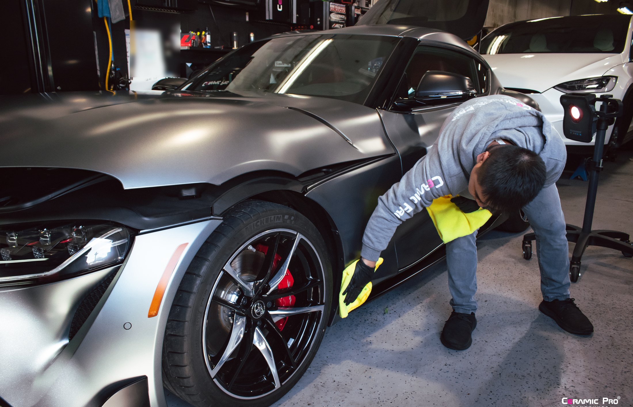 Wipe-down process during Ceramic Pro matte paint coating on a Toyota Supra