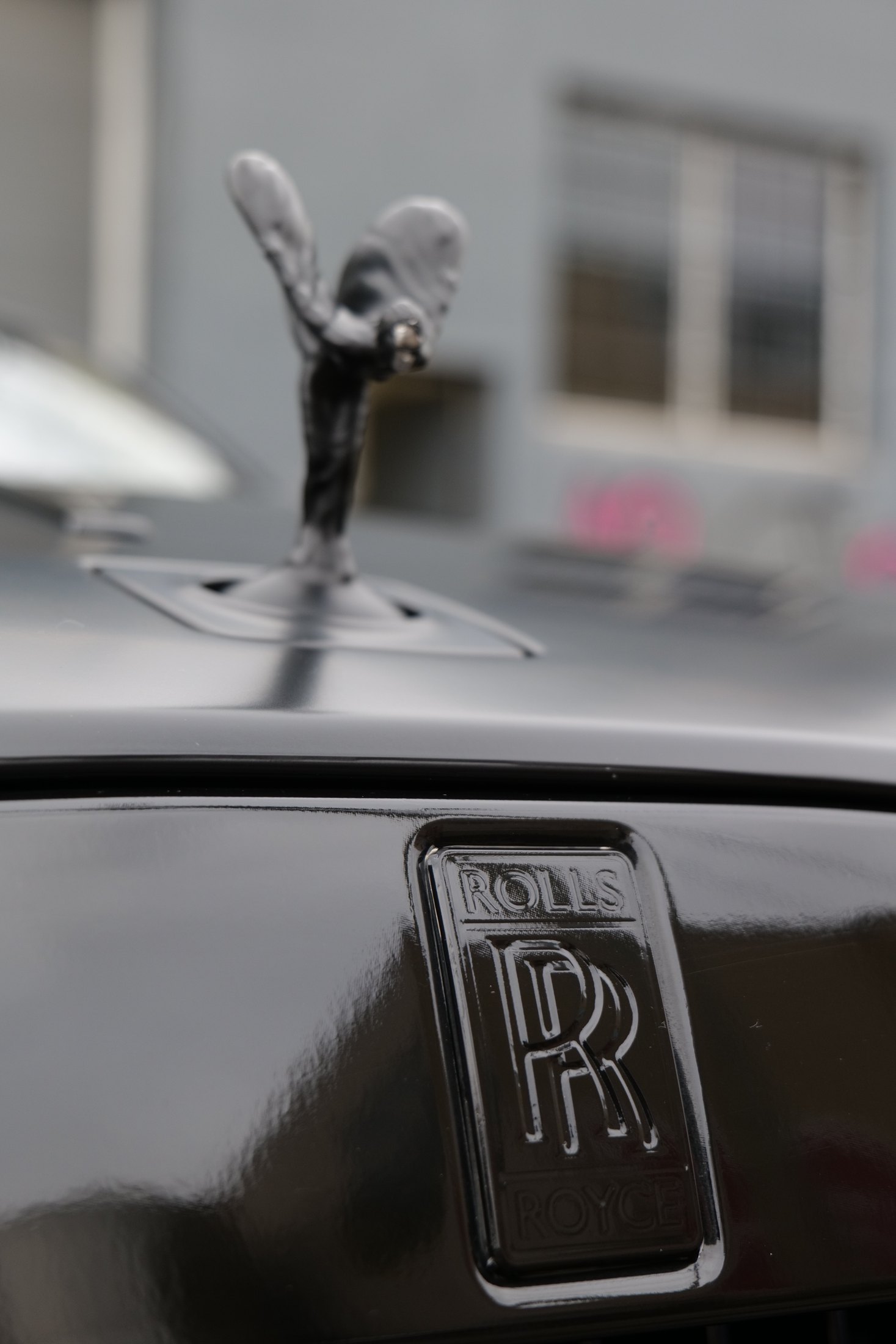 Rolls-Royce badge detail on a Wraith satin black PPF project