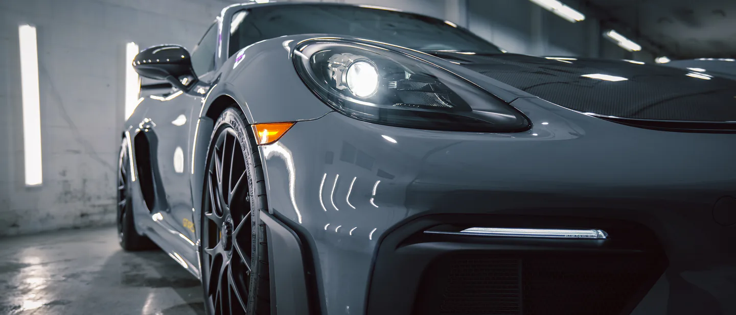 Grey Porsche 718 Cayman GT4 inside the Elements Labs Vancouver studio.