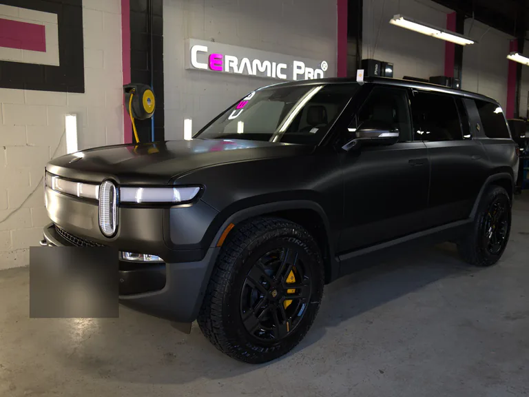 Satin-finish 2024 Rivian SUV after paint protection film installation in Vancouver.